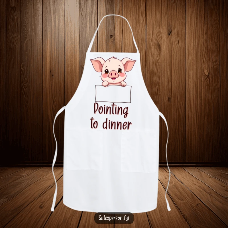 Funny Apron depicting a curious piglet pointing towards a banner with a hopeful look, perfect for kitchen duties with a touch of whimsy.