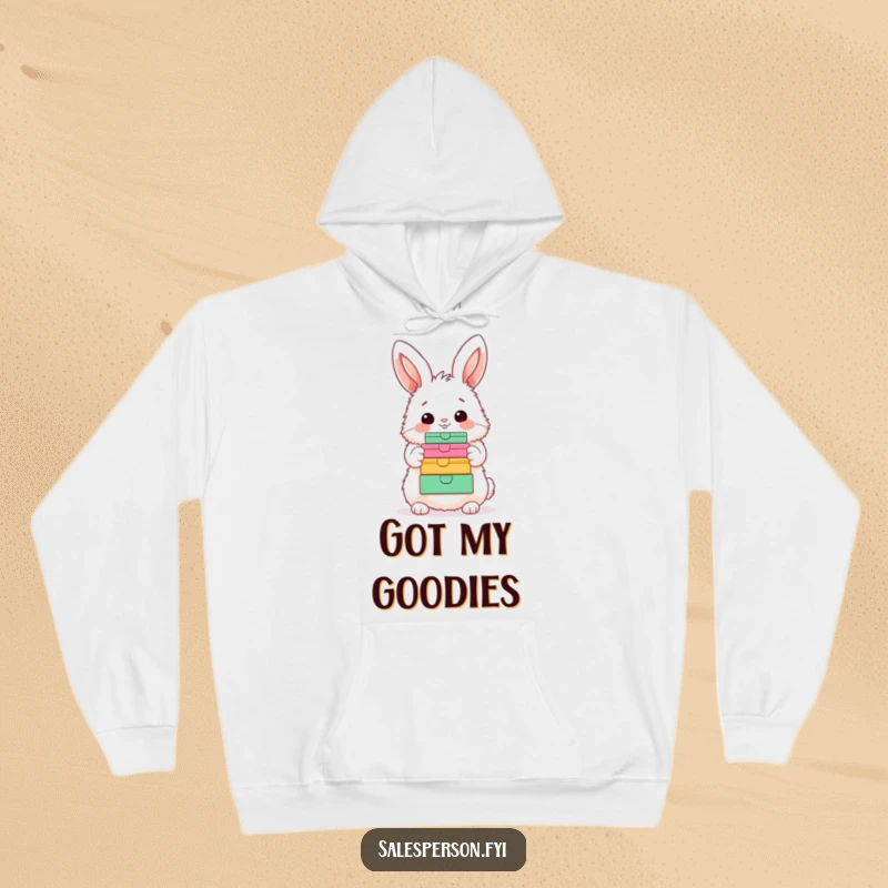 Funny Bunny Hoodie: A fluffy bunny joyfully showcasing a colorful stack of boxes with a happy nod, ideal for cozy humor.