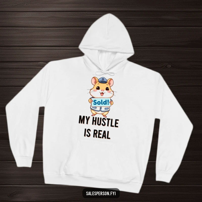 Funny hoodie featuring an energetic hamster in uniform holding a 'Sold!' sign, symbolizing accomplishment and dedication.