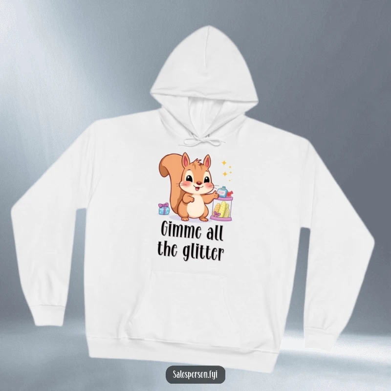 Funny squirrel hoodie with a content rodent pointing at sparkling items, ideal for cozy, humorous enjoyment.