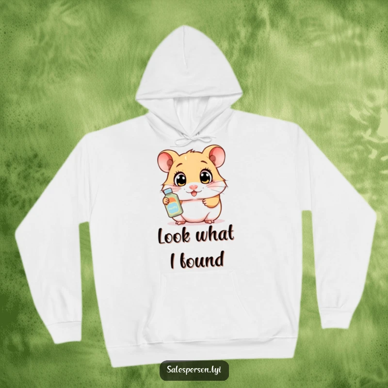 Funny hoodie showcasing a curious hamster with wide eyes demonstrating a product, offering warmth and enthusiastic humor.