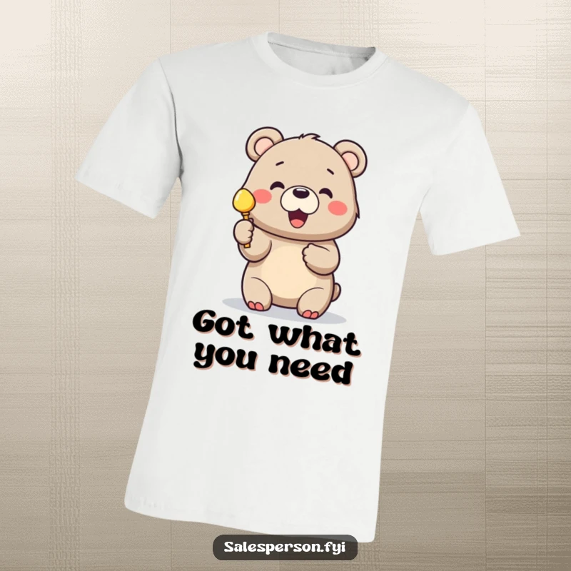 Funny bear t-shirt with a cheerful bear holding up a shiny object with great excitement for customers.