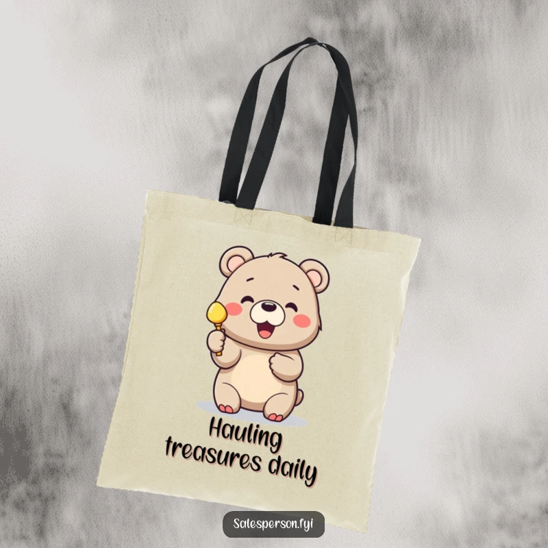 Funny tote bag with a cheerful bear holding up a shiny object, symbolizing a great offer.
